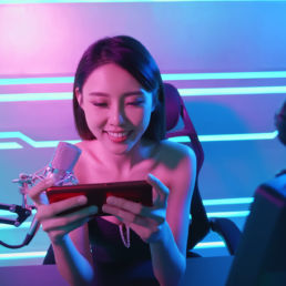 Girl gamer playing mobile game on stream