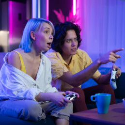 happy-boyfriend-and-girlfriend-playing-video-games