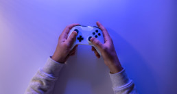 Hands holding a video game controller